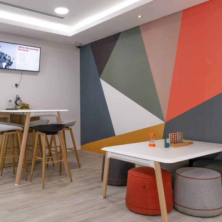 Stylish shared workspace with vibrant accents, perfect for productivity and innovation in UAE.
