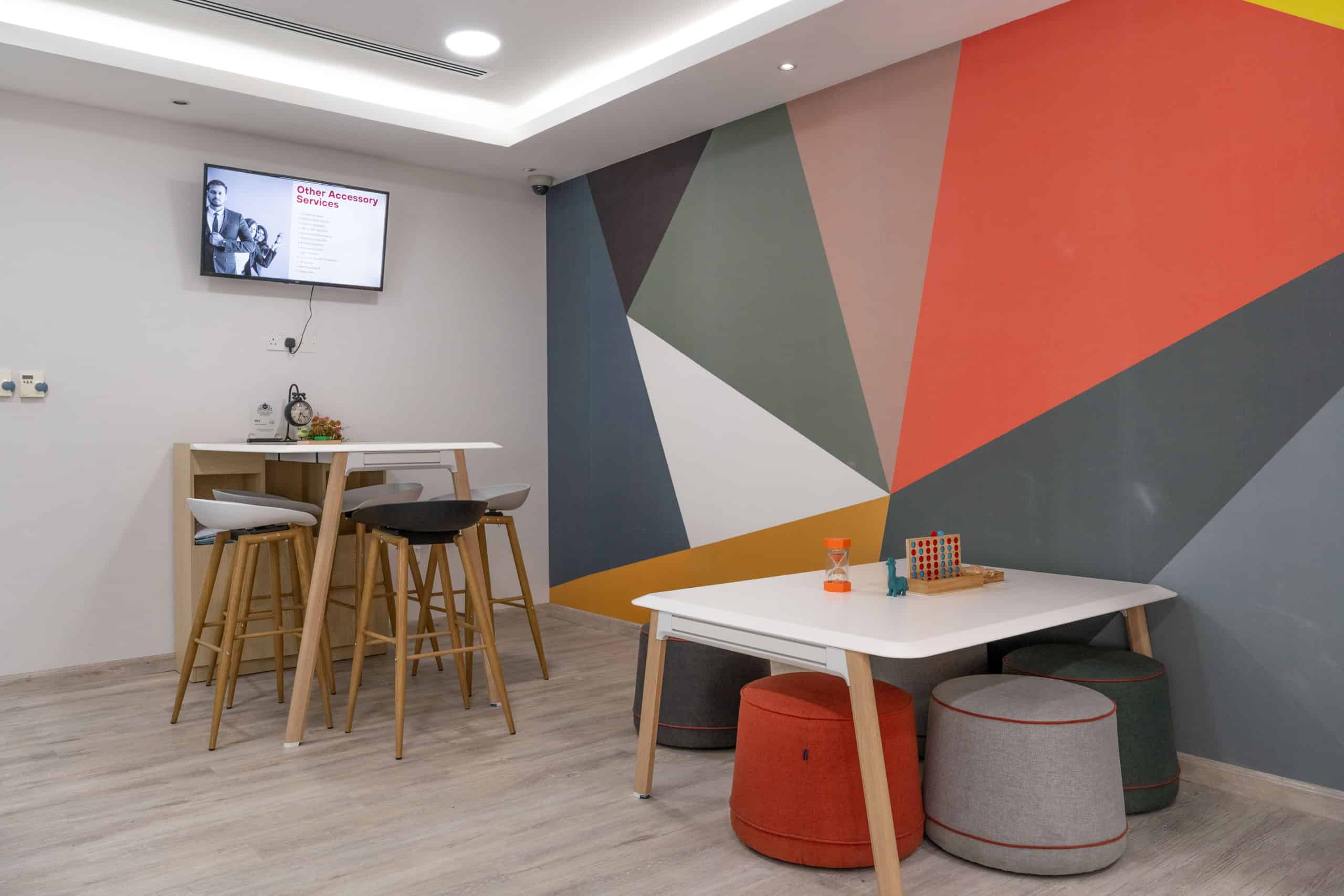 Stylish shared workspace with vibrant accents, perfect for productivity and innovation in UAE.