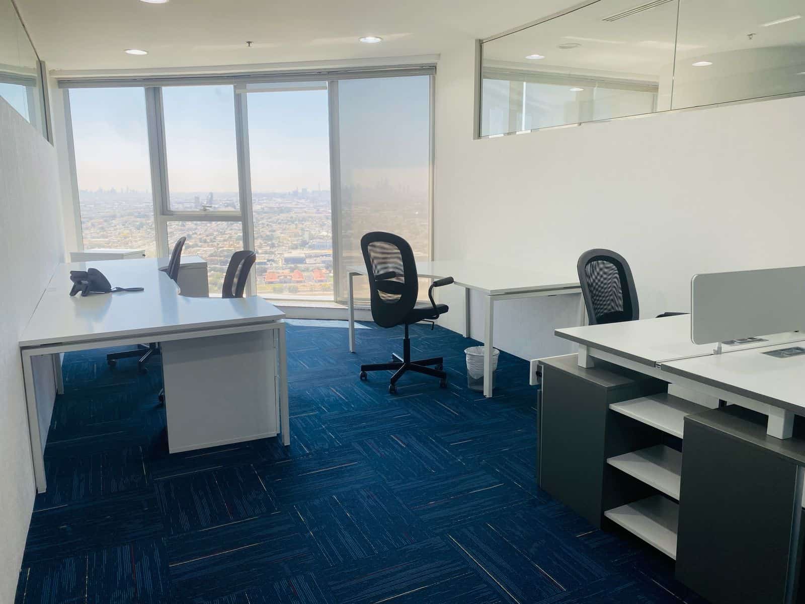 Bright office with large windows and minimal decor in Dubai CBD.