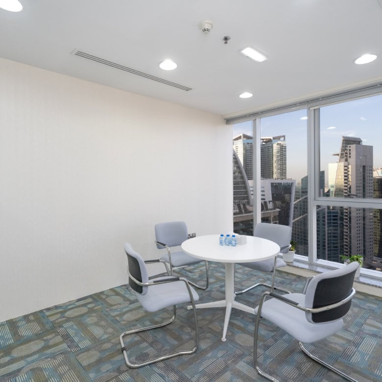 Modern coworking space with city views in Dubai, UAE.