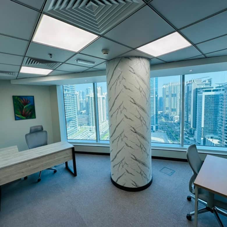 Modern coworking space in Dubai with panoramic city views.