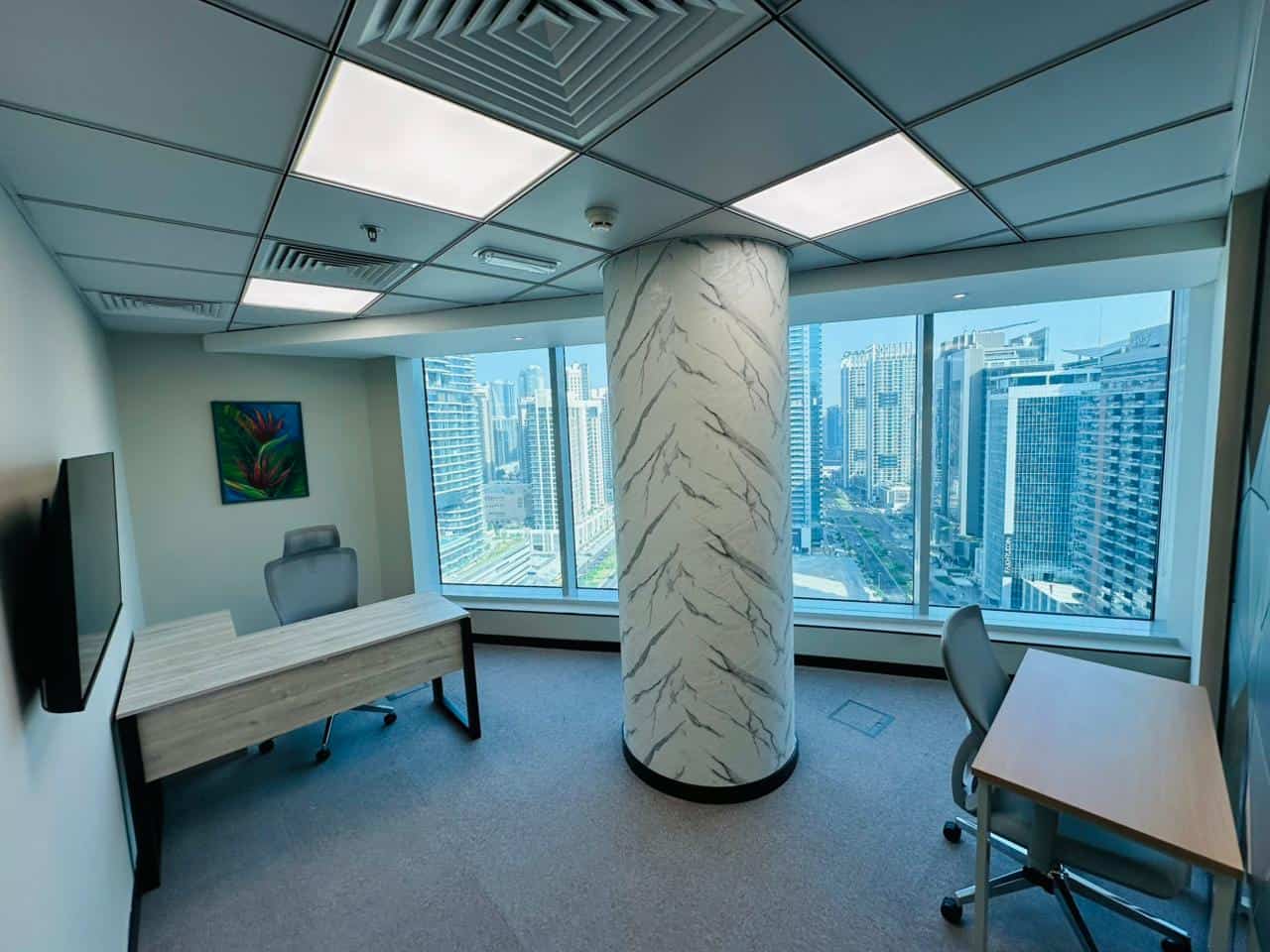 Modern coworking space in Dubai with panoramic city views.