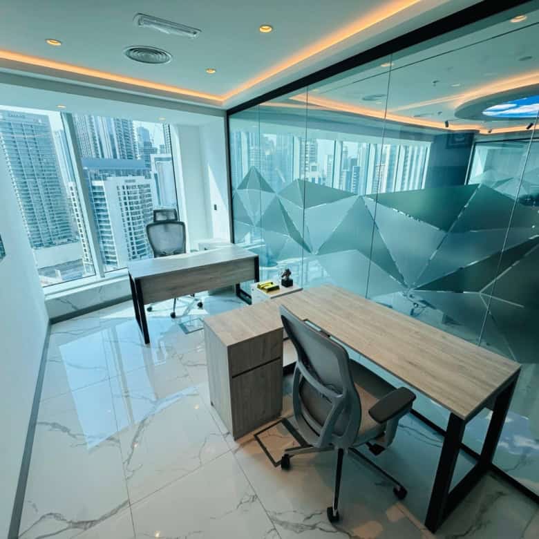 Bright Dubai office with panoramic city views, modern furnishings, and glass walls for productive work.