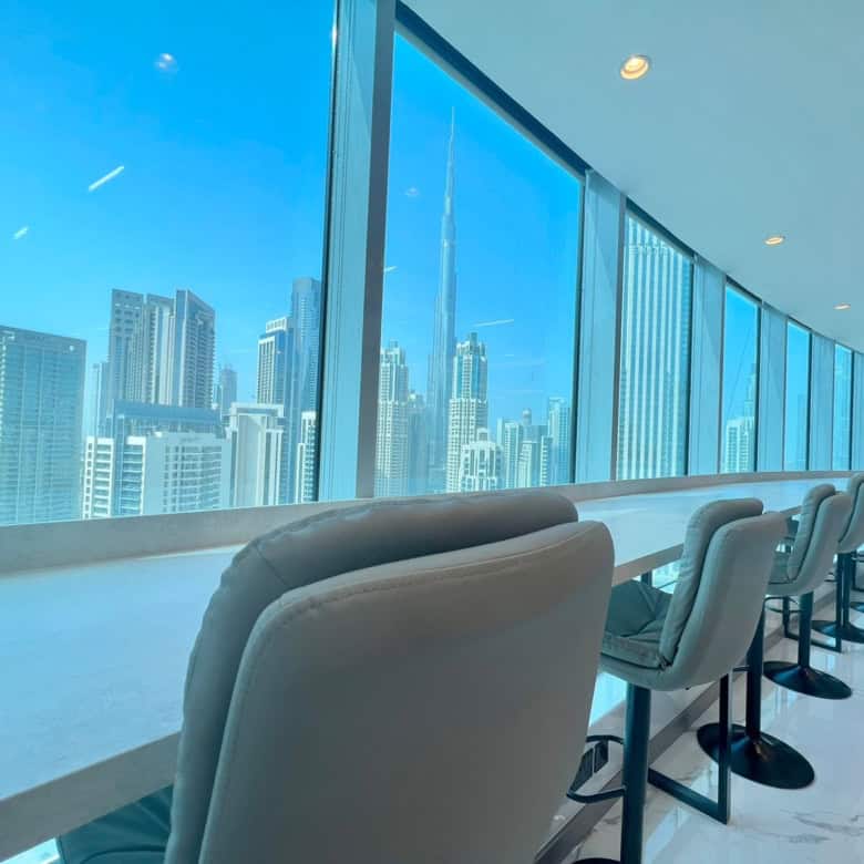 Bright, high-rise office with panoramic city views in Dubai, designed for productive work environments.