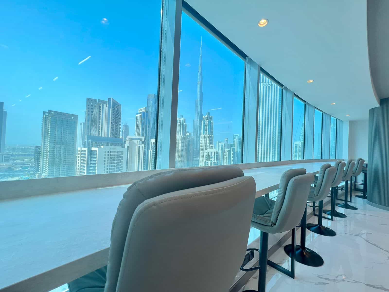 Bright, high-rise office with panoramic city views in Dubai, designed for productive work environments.
