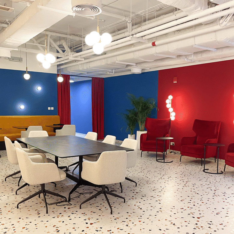 Bright, contemporary office space at Nextspace UAE featuring colorful walls, stylish seating, and collaborative work areas.