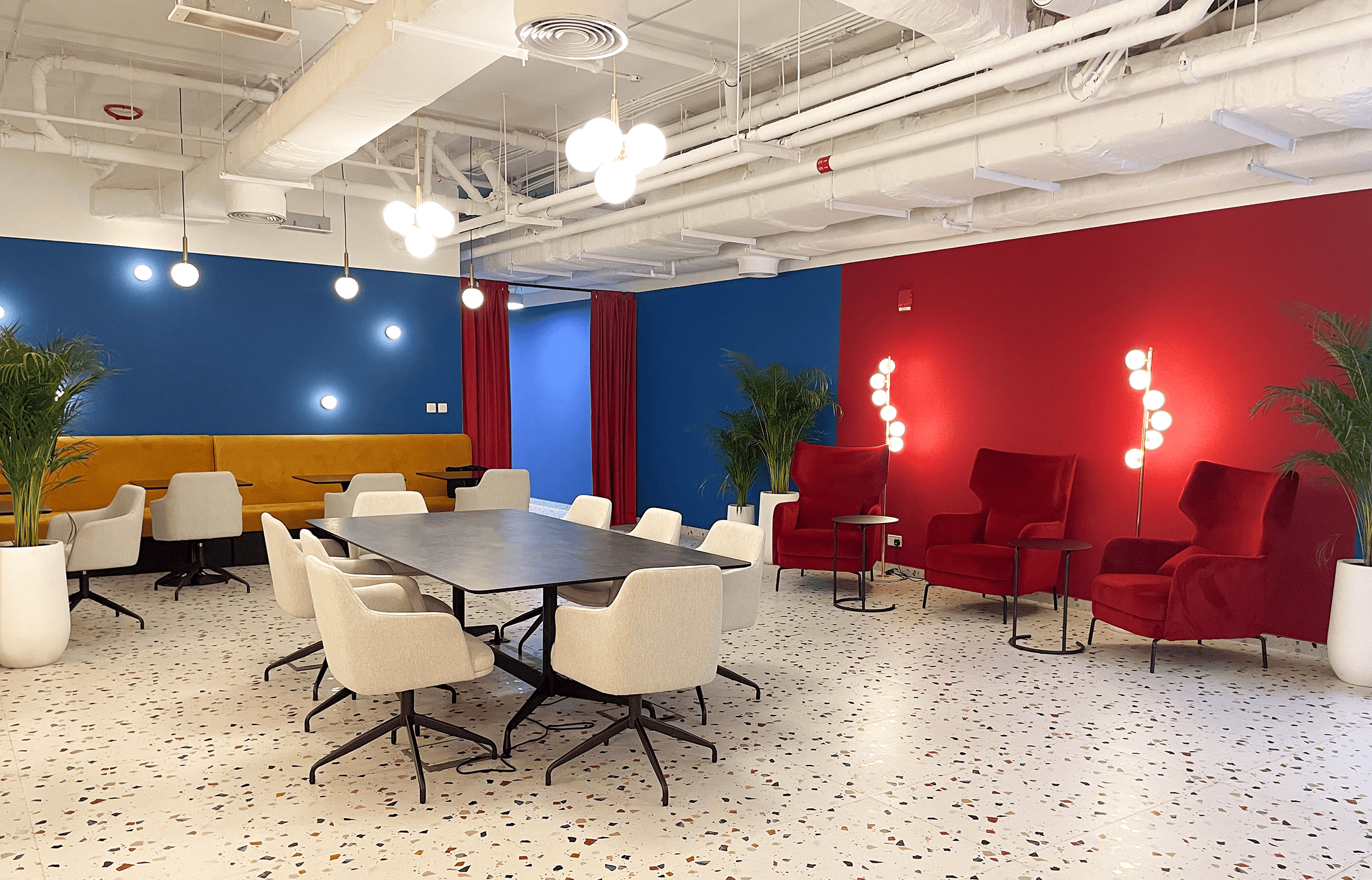 Bright, contemporary office space at Nextspace UAE featuring colorful walls, stylish seating, and collaborative work areas.