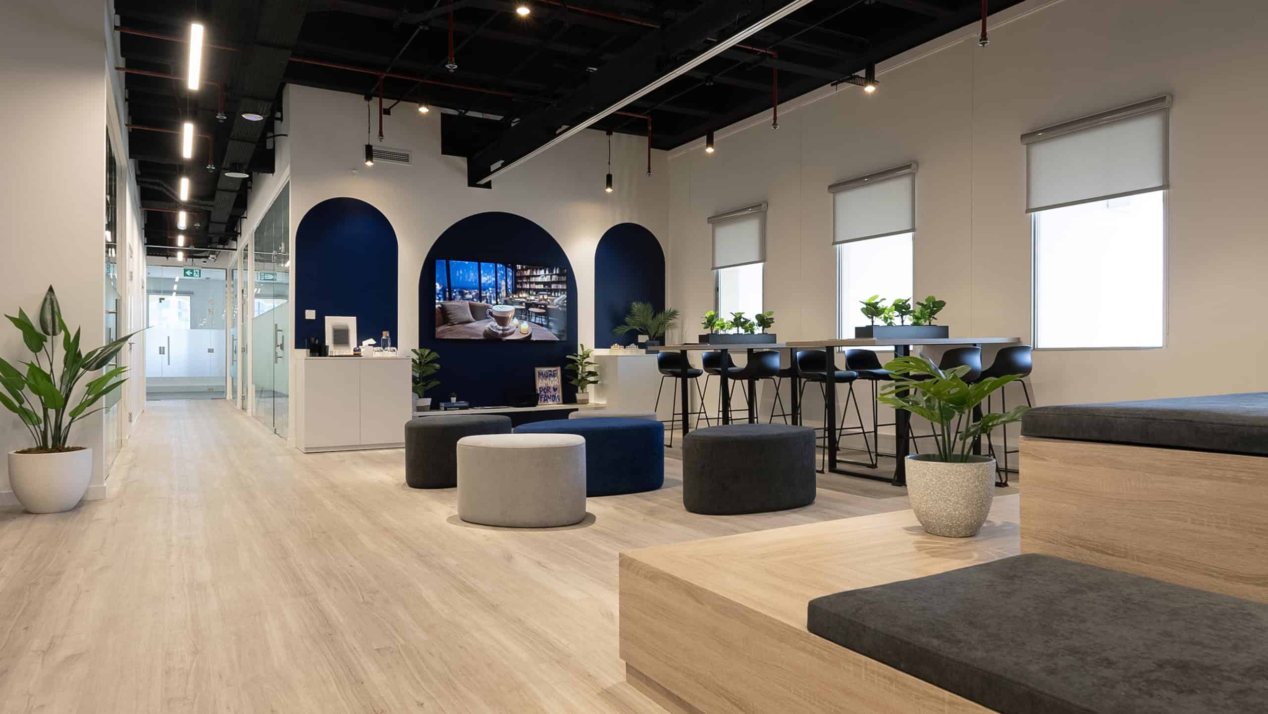 Modern coworking space in Dubai with seamless work areas and vibrant interior design.