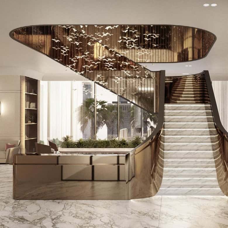 Luxurious interior of a coworking space in Dubai, featuring elegant staircase and modern decor elements.