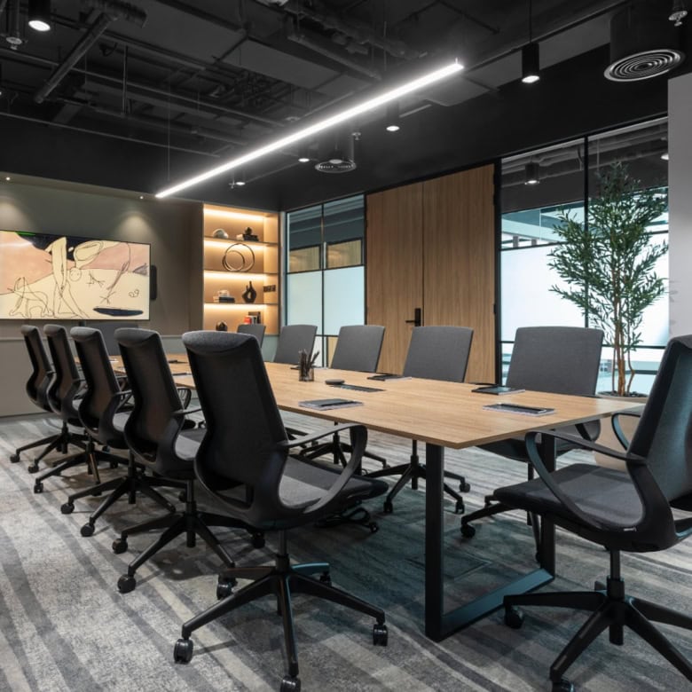 Bright, professional meeting room with sleek furniture and contemporary decor.