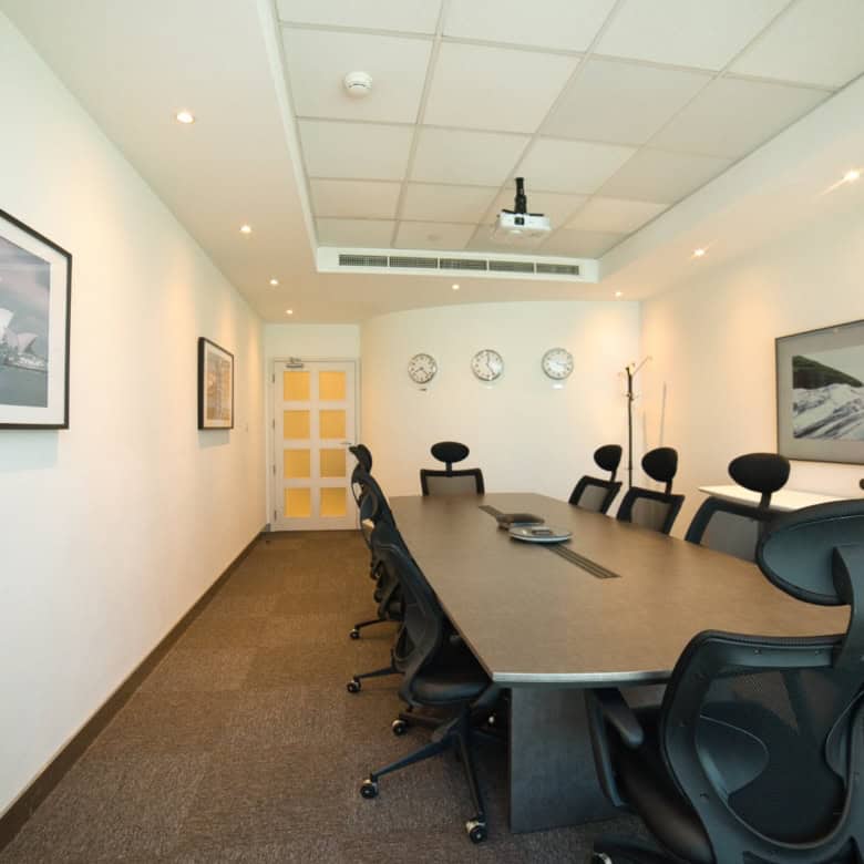 Clean and stylish conference room with ergonomic chairs and professional ambiance.