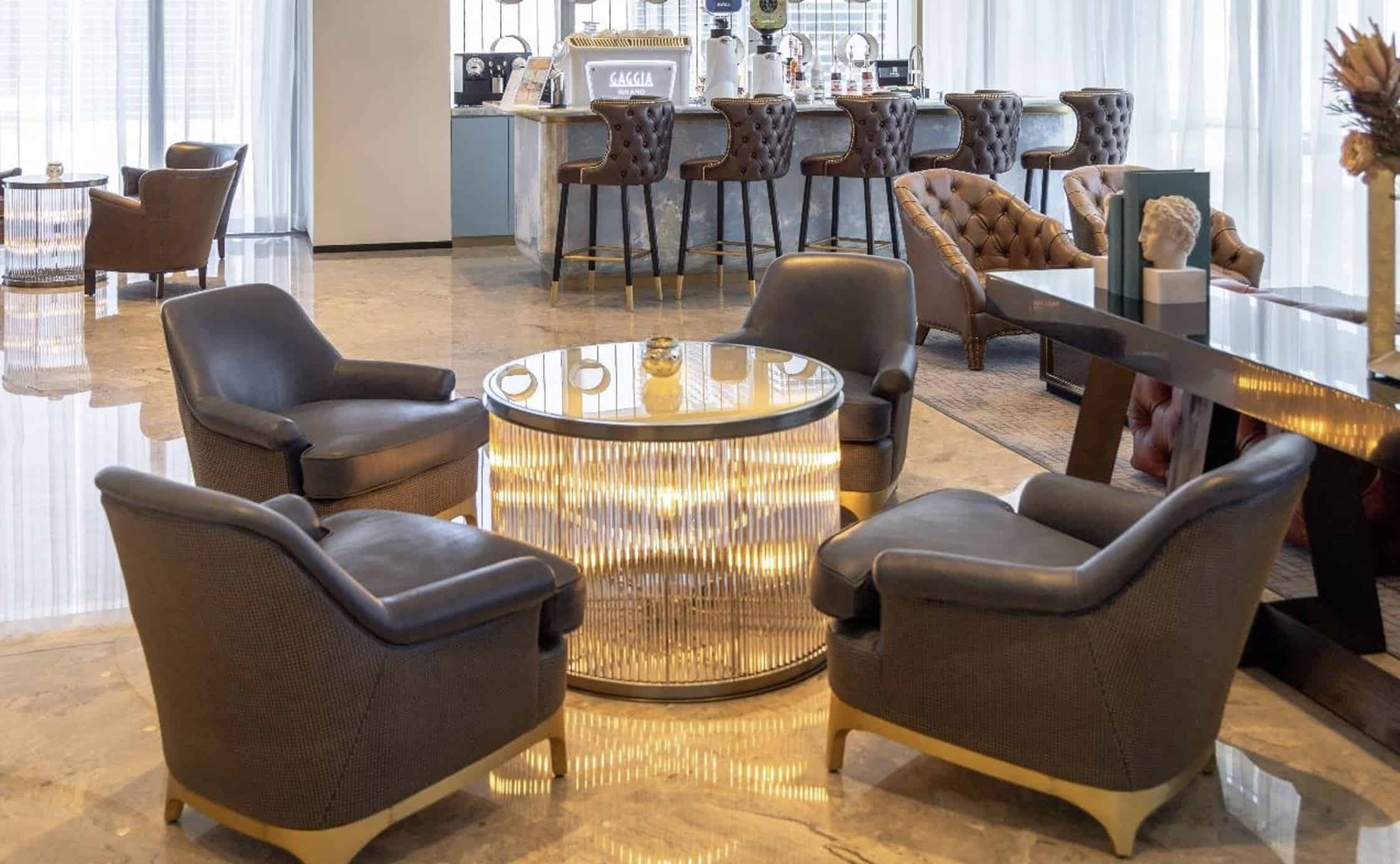 Spacious lounge area featuring contemporary chairs and elegant decor, ideal for remote work and networking.