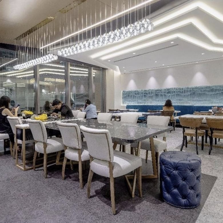 Elegant interior of Nextspace UAE coworking lounge with contemporary decor and bright ambiance.