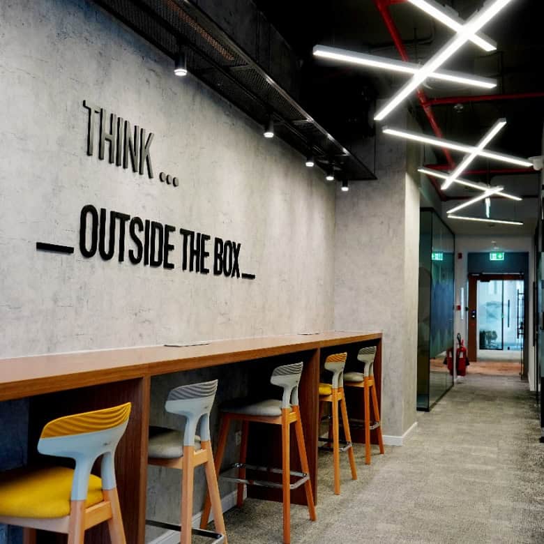 Modern interior design with vibrant lighting at Nextspace UAE office.