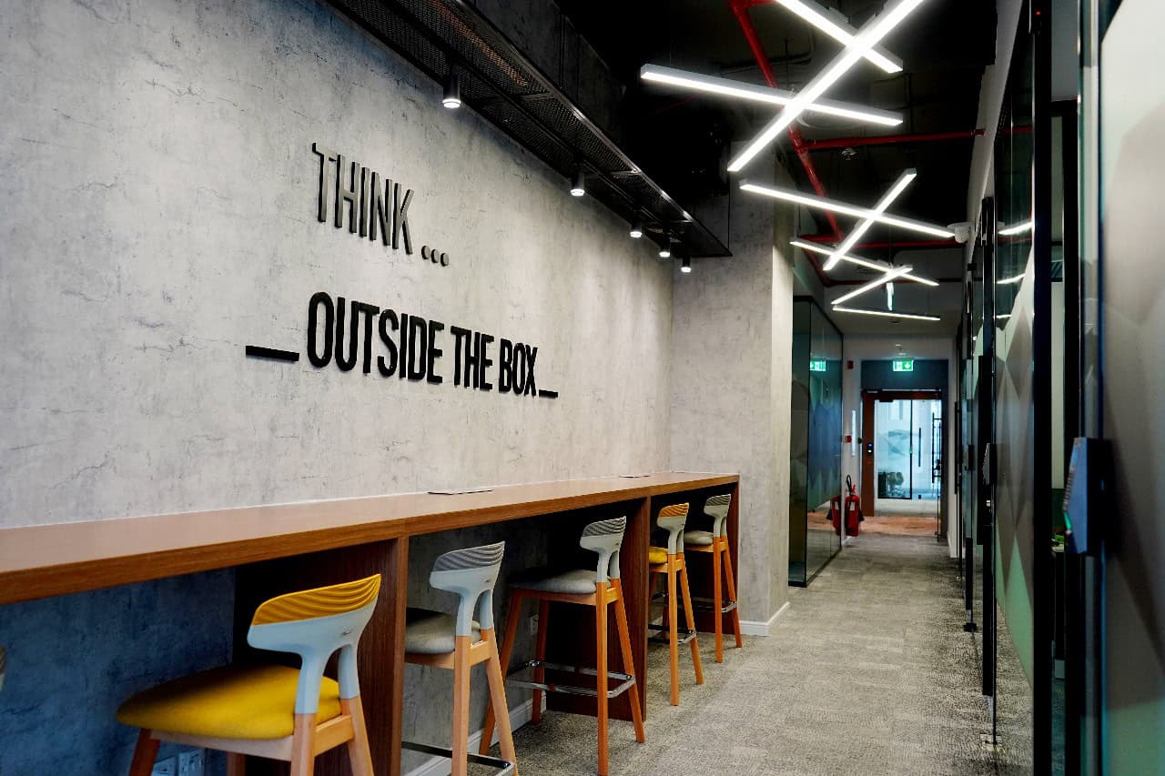 Modern interior design with vibrant lighting at Nextspace UAE office.