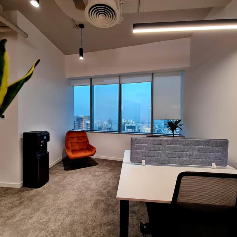 Bright office space at Nextspace UAE featuring stylish furniture and cityscape views.