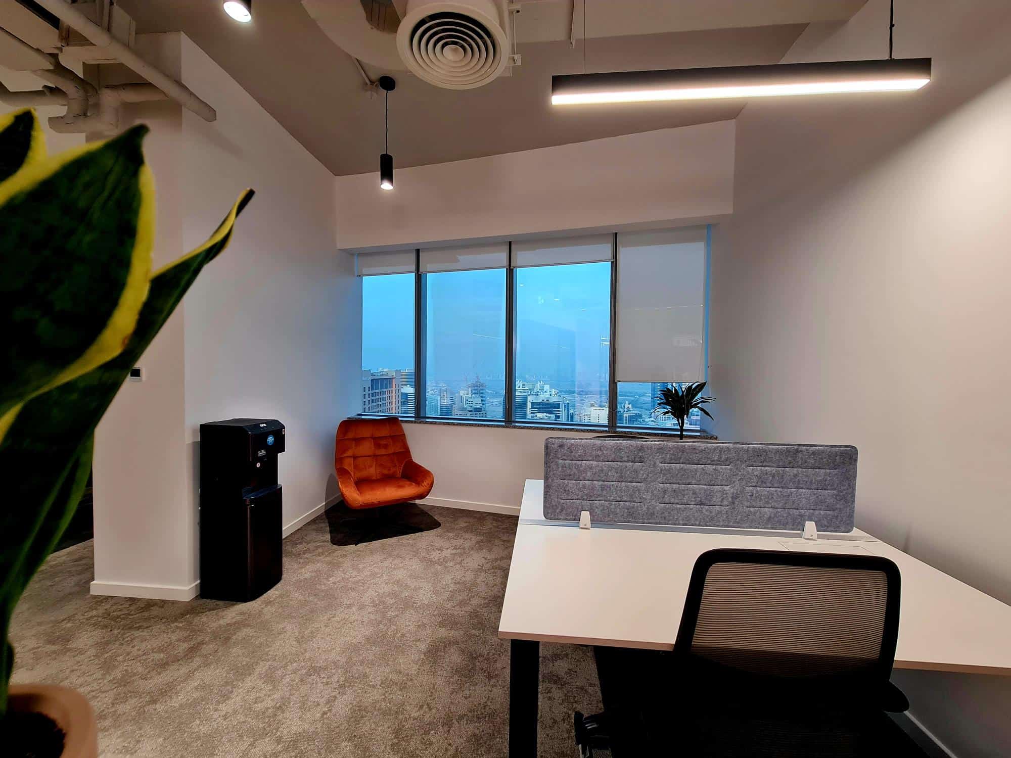 Bright office space at Nextspace UAE featuring stylish furniture and cityscape views.