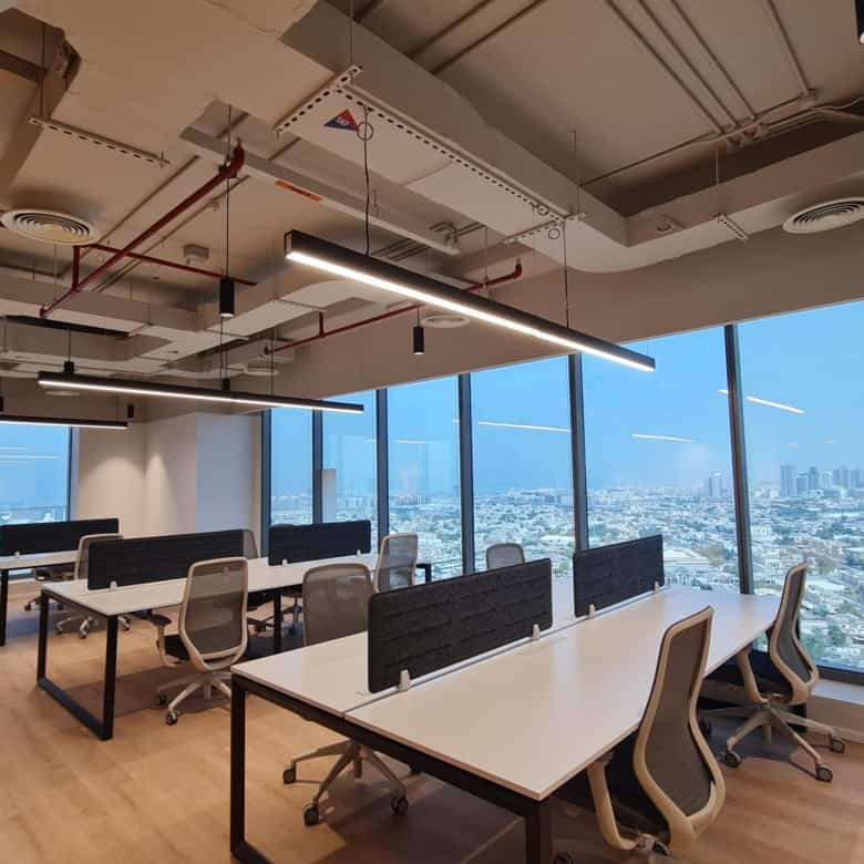 Bright office with panoramic city views, modern furniture, and flexible workspace for startups and professionals.