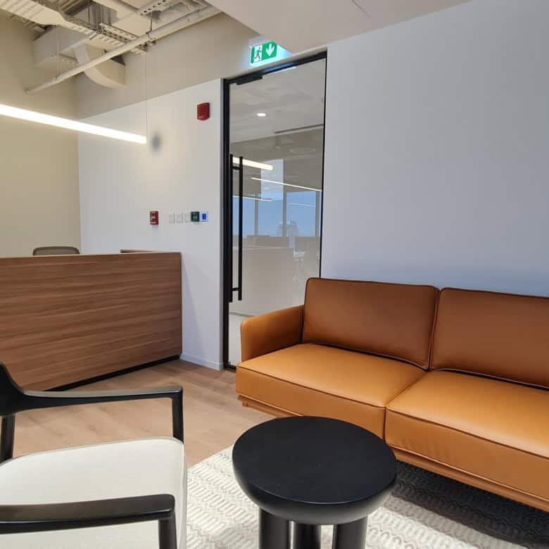 Comfortable coworking lounge at Nextspace UAE with modern furniture and inviting atmosphere.