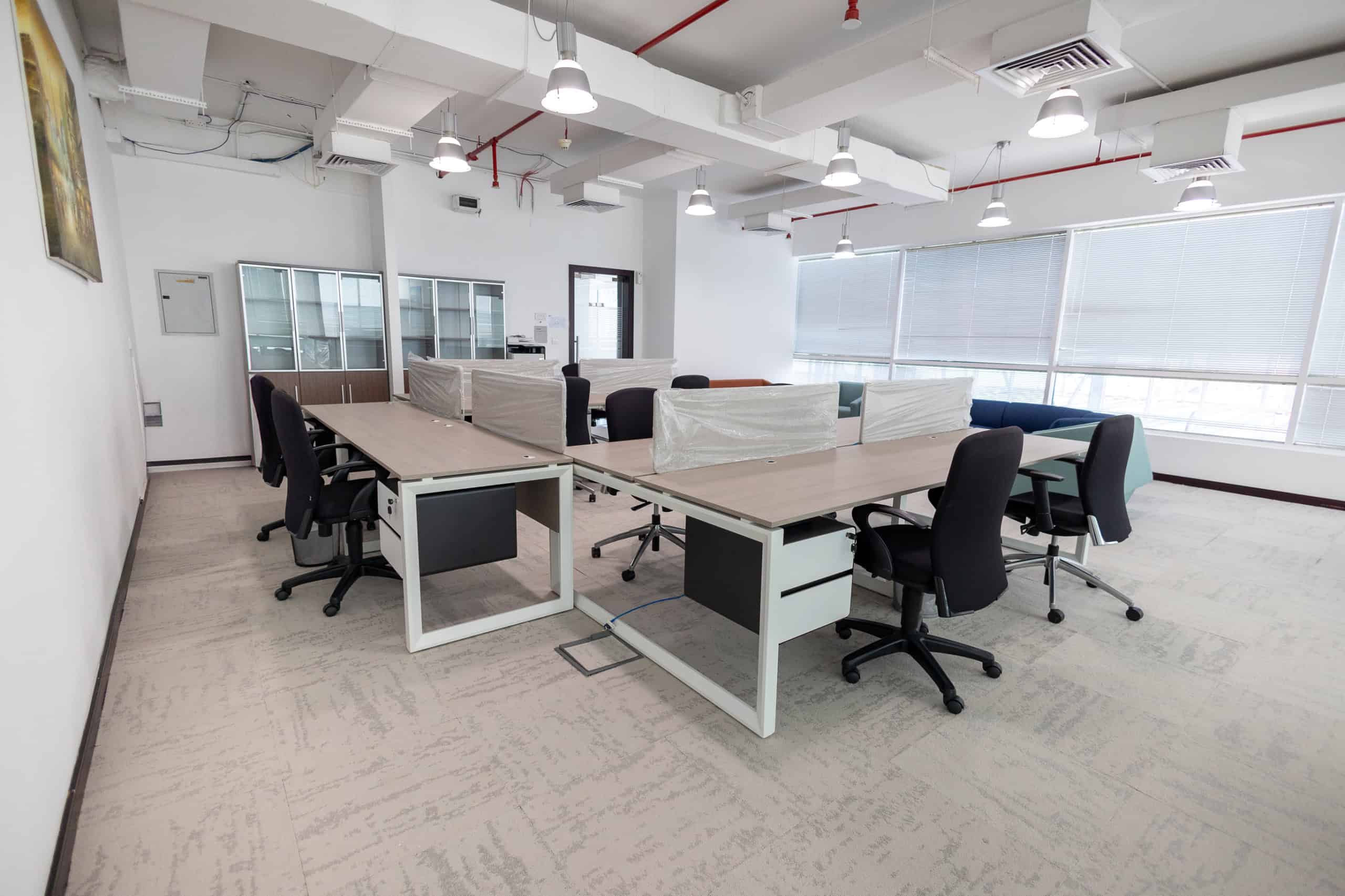 Bright shared office with ergonomic chairs and workstations in Dubai UAE.
