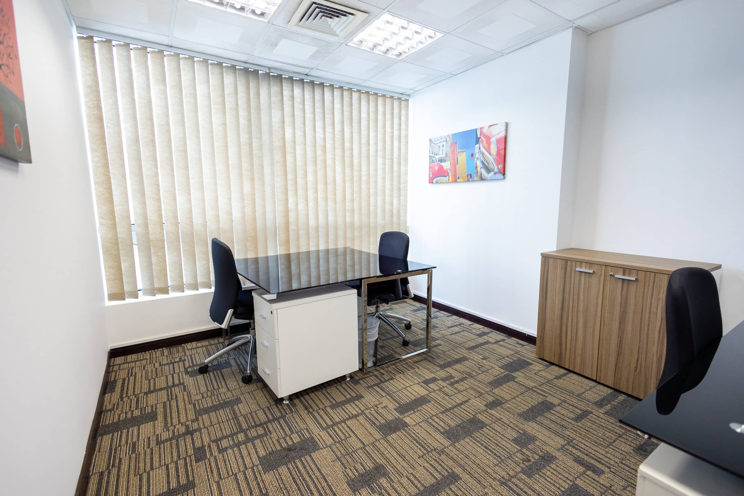 Clean, professional workspace with desks and storage in Dubai UAE office environment.