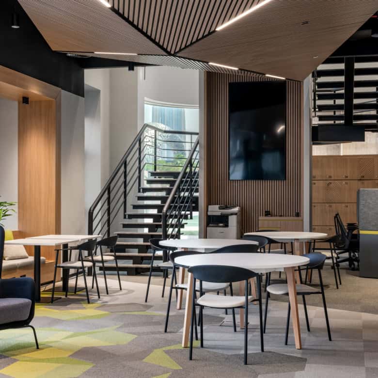 Bright, contemporary workspace at Nextspace UAE featuring open seating, meeting zones, and modern decor.