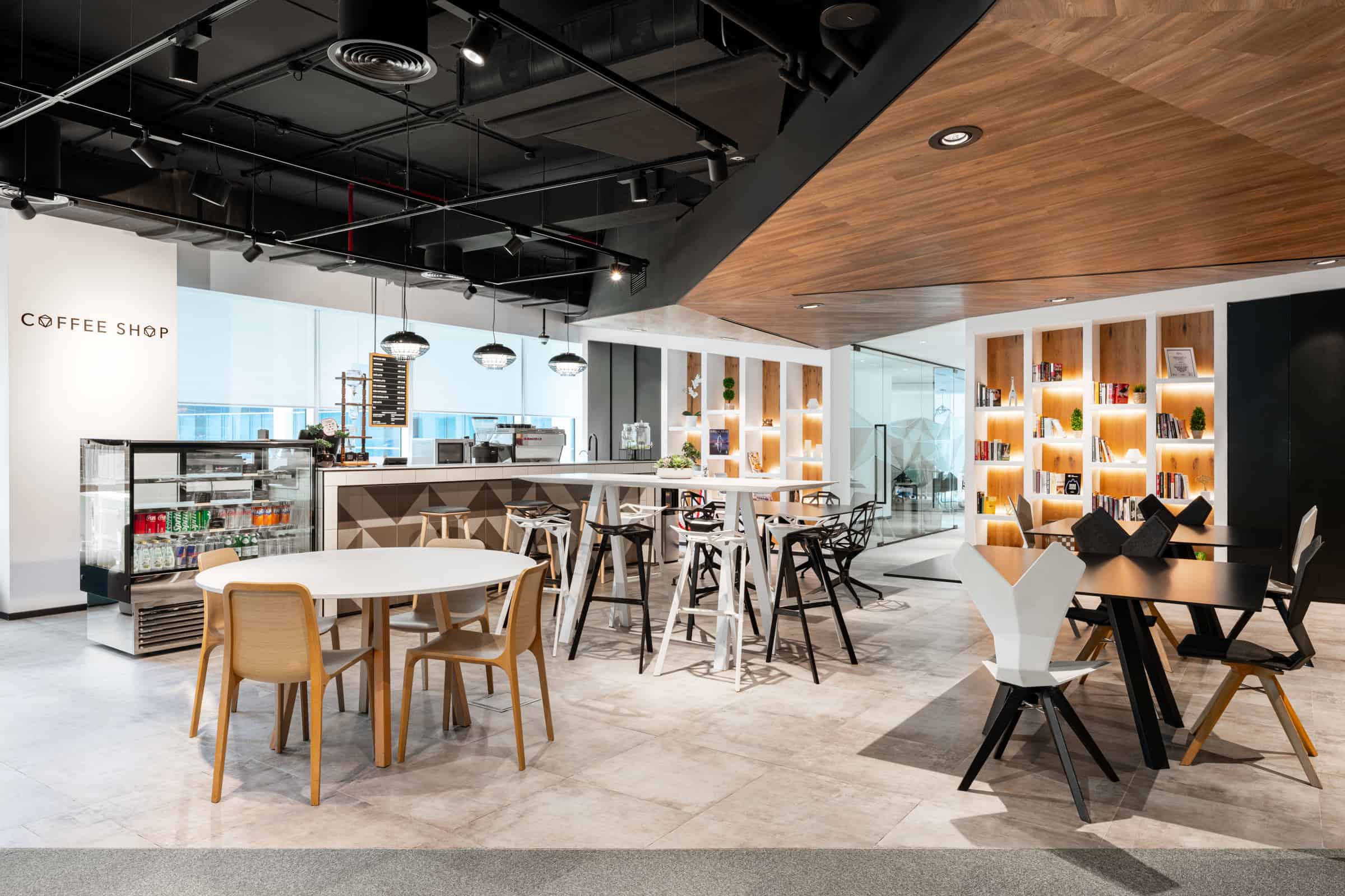 Modern coworking space in UAE with stylish furniture and vibrant atmosphere. Chic coworking and shared office space in UAE with cozy seating, modern design, perfect for startups.