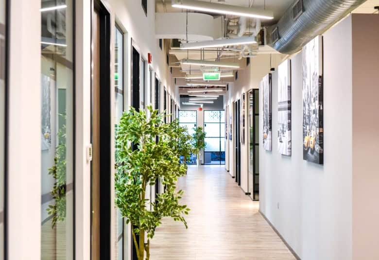 Modern co-working space in Dubai with vibrant interior and natural lighting.