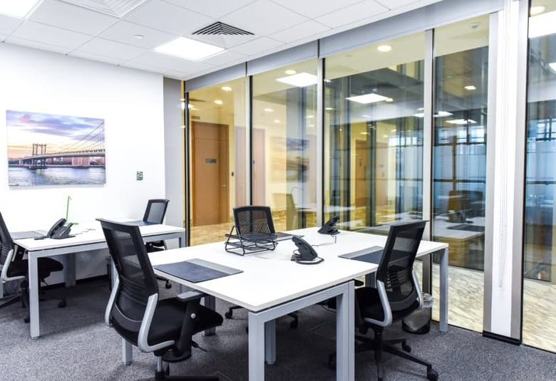 Bright, professional coworking office with meeting rooms and workstations in Dubai UAE.
