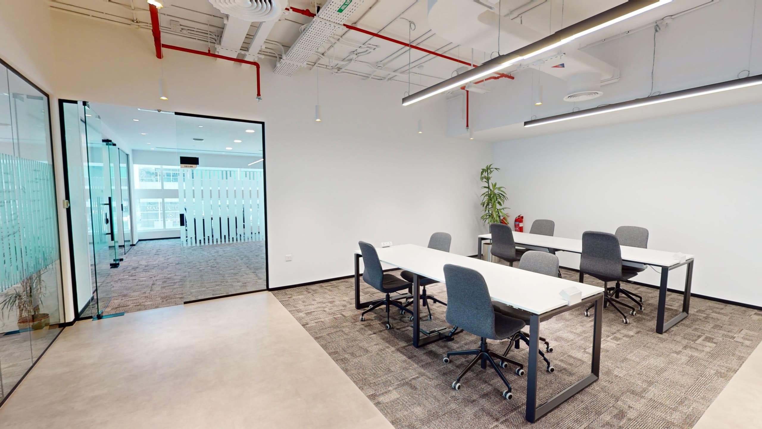 Versatile workspace with desks, chairs, and contemporary design in Nextspace UAE office.