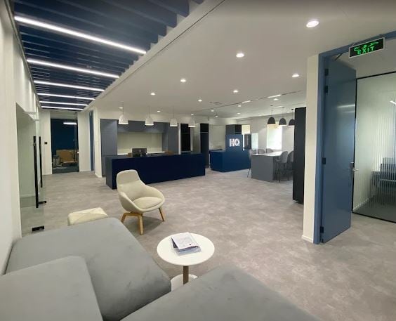 Modern coworking space in Dubai with stylish lounge areas and communal desks.