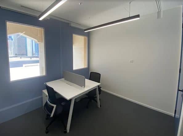 Modern coworking office in Dubai with natural light and flexible seating options.