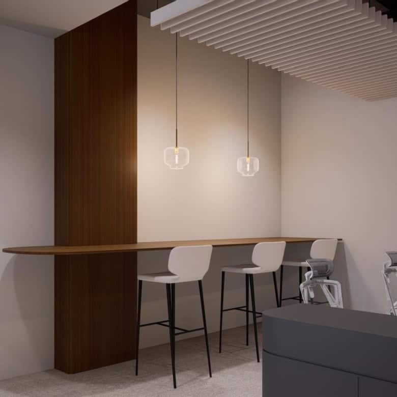 Contemporary UAE office interior with high-top seating and elegant pendant lights.