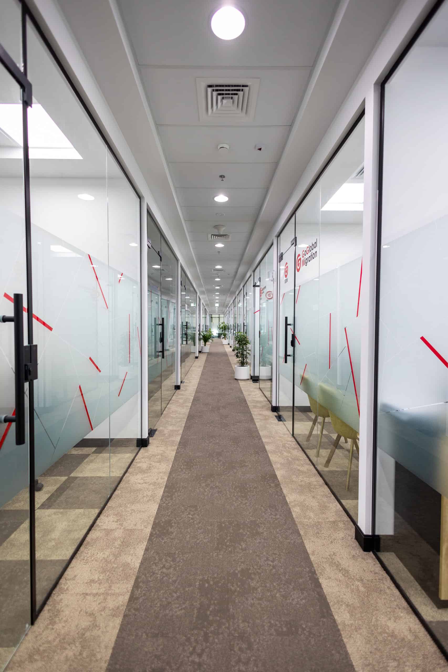 Glass office doors and corridor at Nextspace UAE coworking hub.