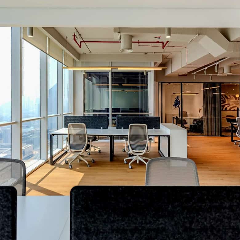 Bright modern coworking space with city views at Nextspace UAE coworking offices.