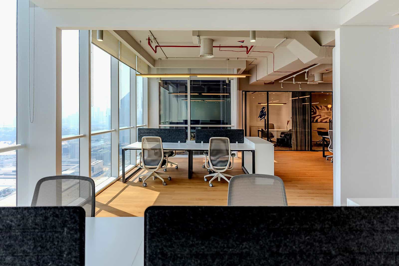 Bright modern coworking space with city views at Nextspace UAE coworking offices.
