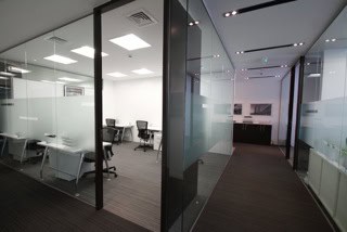Modern coworking space in Dubai with private offices and conference rooms.