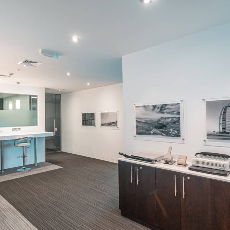 Modern coworking workspace with private desks, meeting rooms, and lounge areas in Dubai.