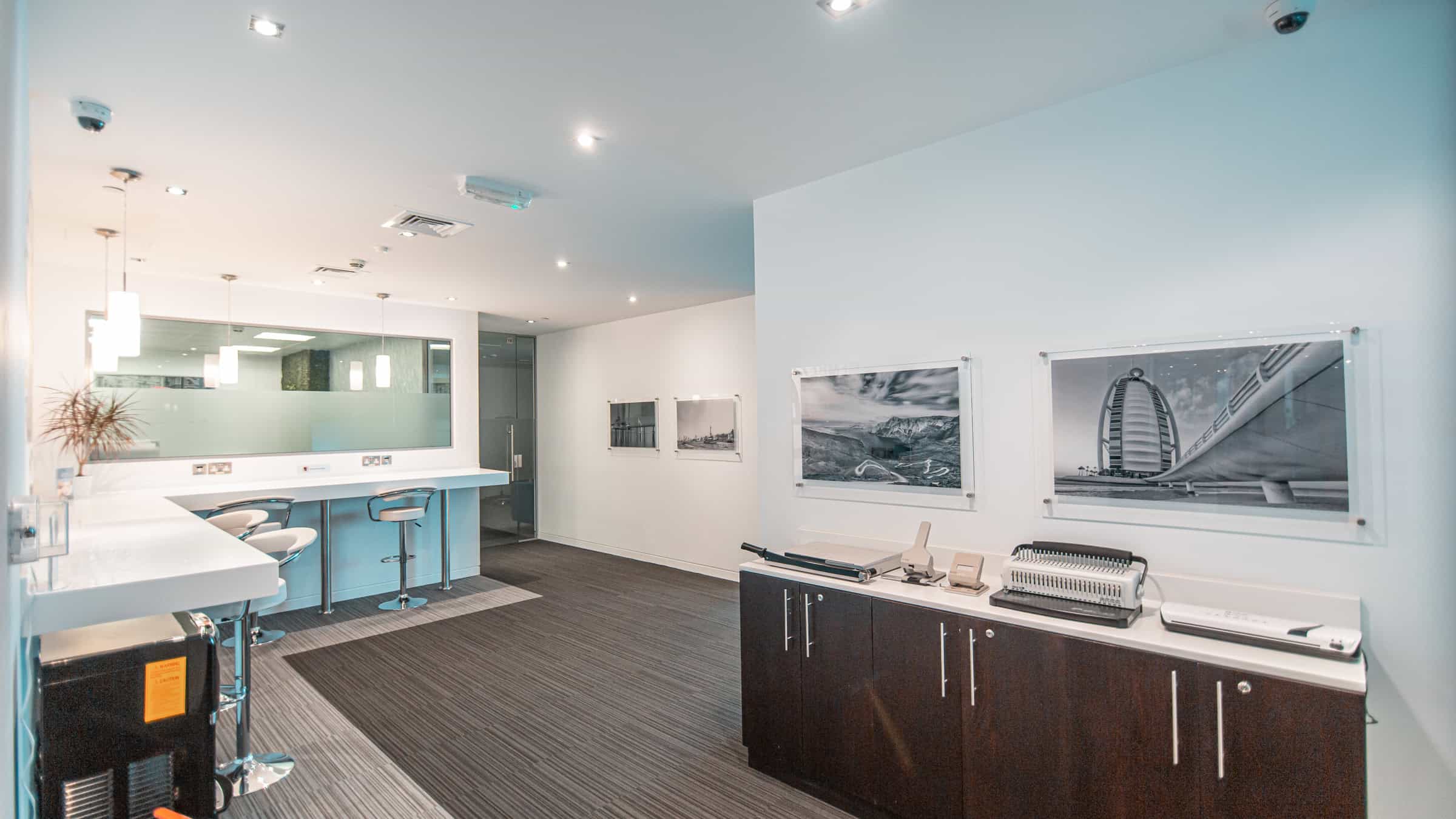 Modern coworking workspace with private desks, meeting rooms, and lounge areas in Dubai.