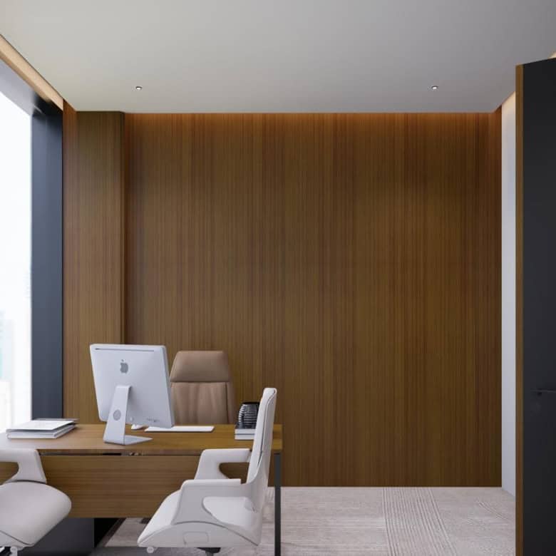 Stylish office interior with wooden decor, large windows, and ergonomic furniture in Dubai office space.
