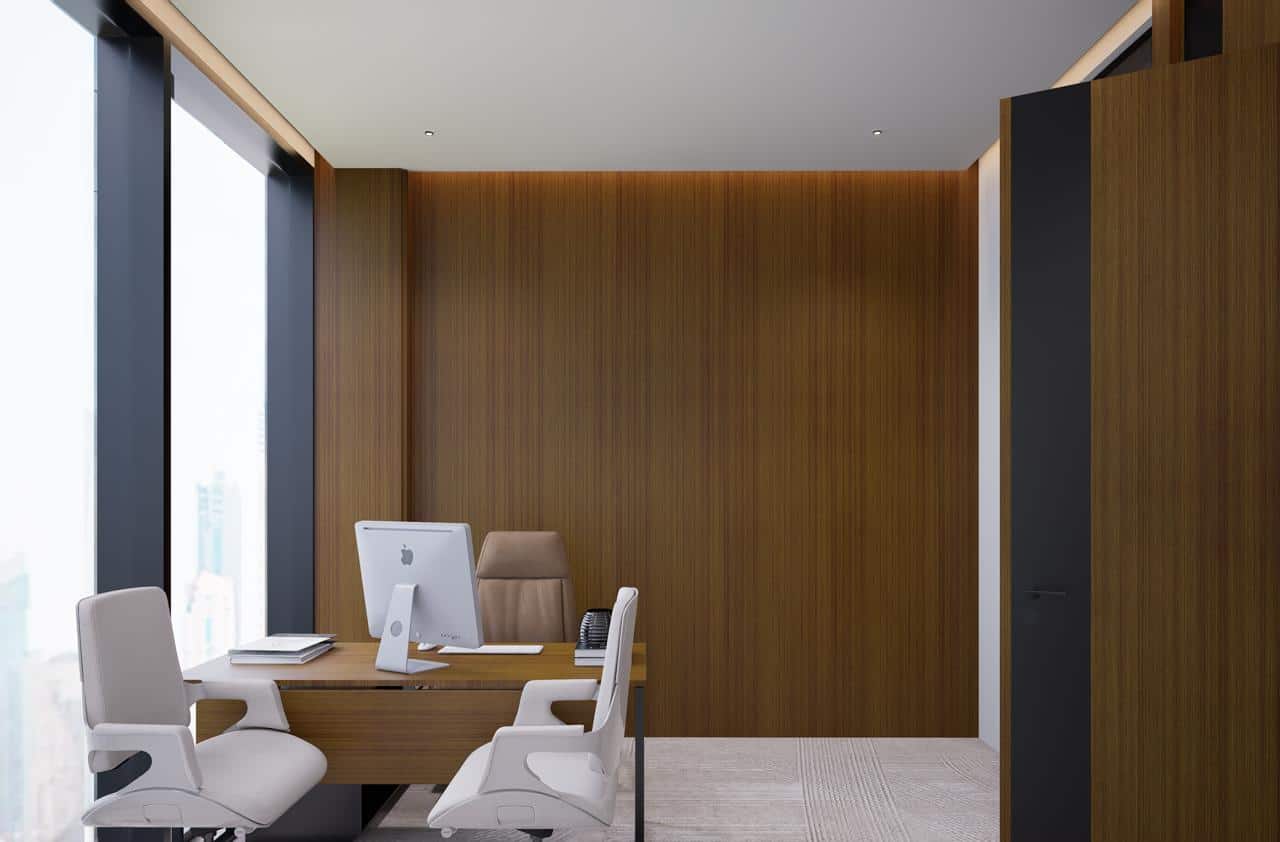 Sophisticated modern office setup in UAE featuring sleek wood design, large windows, and contemporary furniture for work.