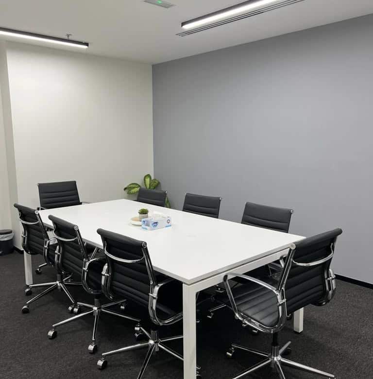 Contemporary meeting room at Nextspace UAE with professional office chairs and minimalist design.