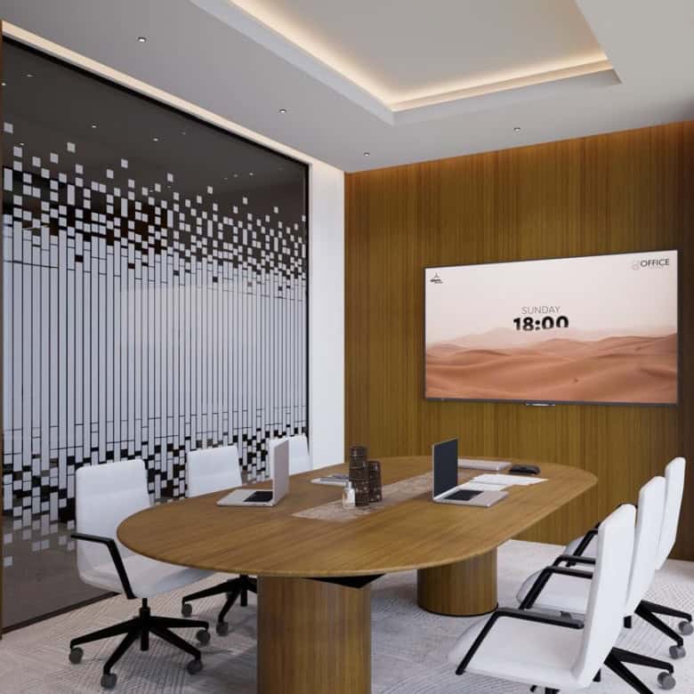 Bright, stylish conference room featuring ergonomic chairs, a large digital display, and high-speed internet.