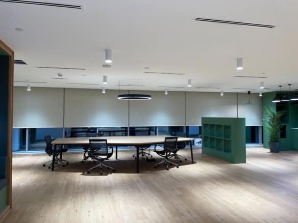 Bright office room with workstations, sleek design, and large windows, ideal for productivity and collaboration in UAE.