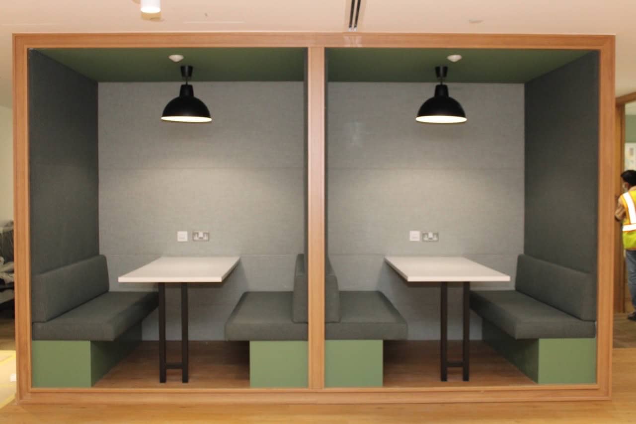 Modern coworking booths in UAE with private seating, ideal for meetings and remote work at Nextspace. Perfect workspace solution.