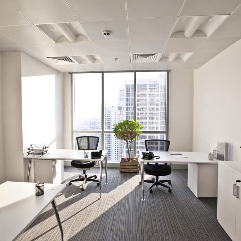 Bright, contemporary office with large windows and seating for productivity in UAE.