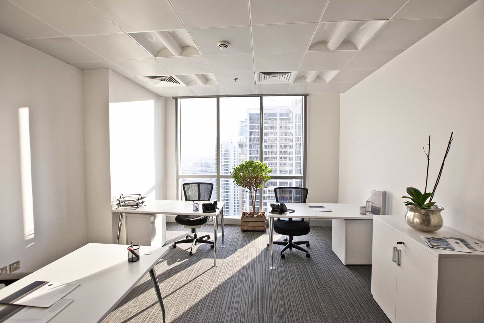 Bright, contemporary office with large windows and seating for productivity in UAE.