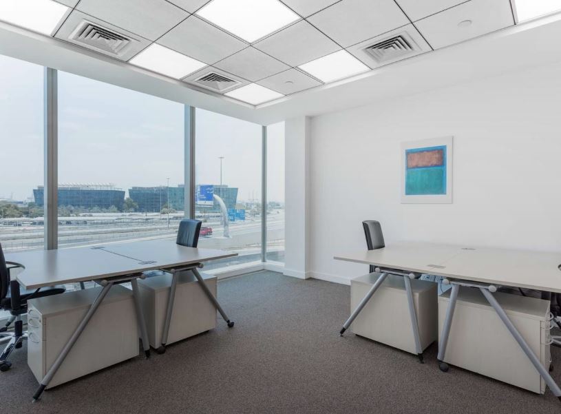 Bright coworking office in Dubai with panoramic city views and contemporary workspace design.