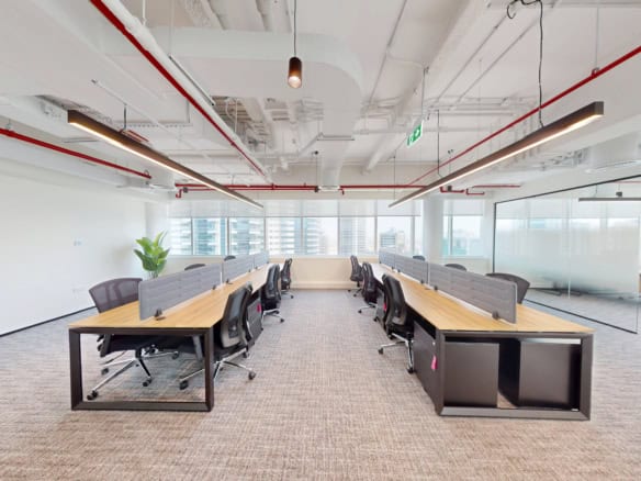 Bright, flexible office environment in Dubai with workstations and meeting areas.