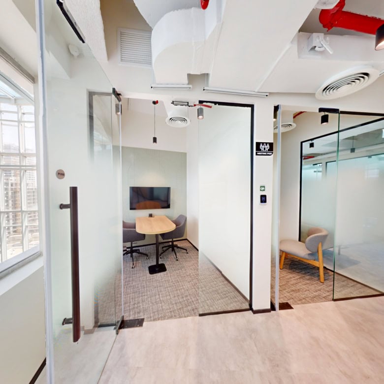 Workspace, coworking, Dubai, glass meeting room, modern office, city views.